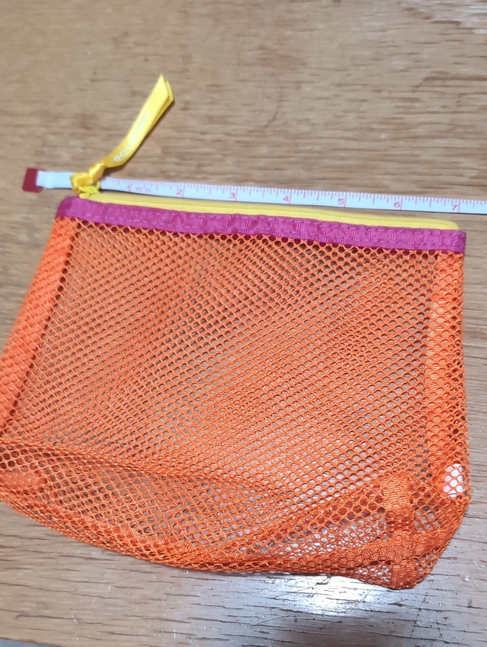 Bright Orange Mesh Cosmetic Pouch with Pink Trim and Yellow Zip Pull